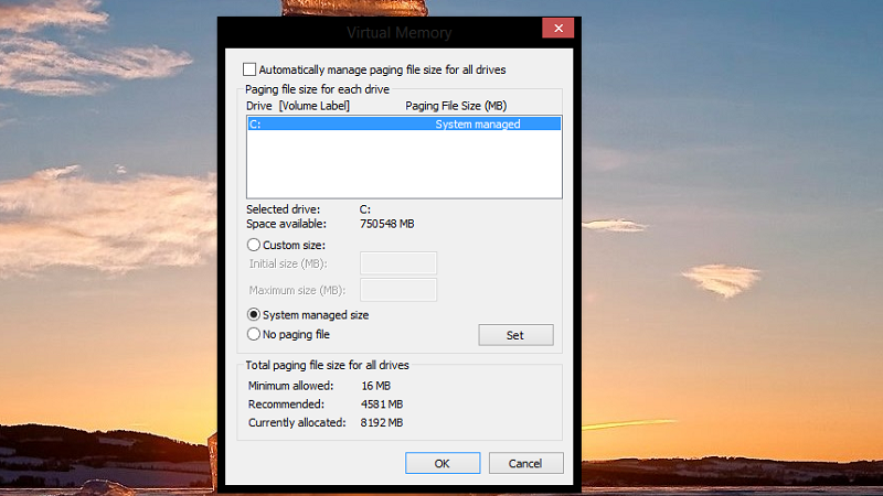 Bỏ tậu mục Automatically manage paging file size of each drive