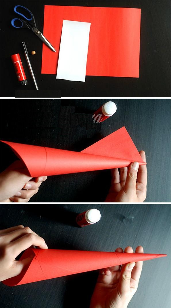 Use red paper to roll into a pyramid, then use glue to fix it.