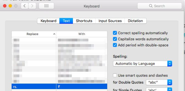 System Preferences > Keyboard > Text.