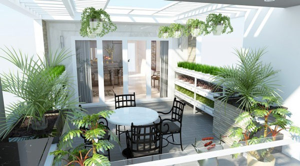 Sân thượng tuyệt đẹp và hiện đại với lan can tay vịn bằng kính, hệ thống tiểu cảnh xanh và chiếc bàn tròn nhỏ