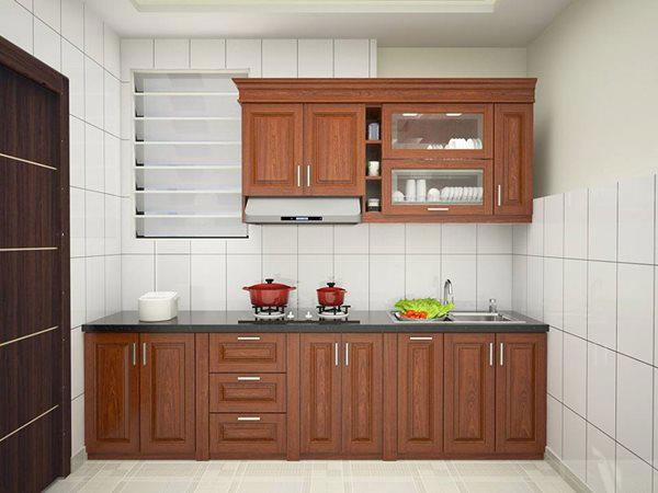 Tủ bếp nhỏ gọn làm bằng gỗ xoan đào tự nhiên phù hợp với chung cư hay ngôi nhà có diện tích nhỏ.