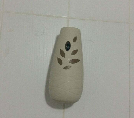 In the bathroom of a shopping mall in Russia, a hidden camera was discovered disguised as an "air freshener".