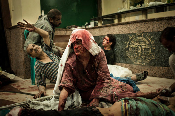 Một cuộc không kích phá hủy một tiệm bánh ở Syria vào tháng 8/2012 khiến nhiều người dân bị thương.
