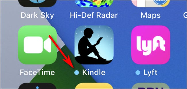 What does the blue dot next to the app icons on the iPhone, iPad home screen mean?