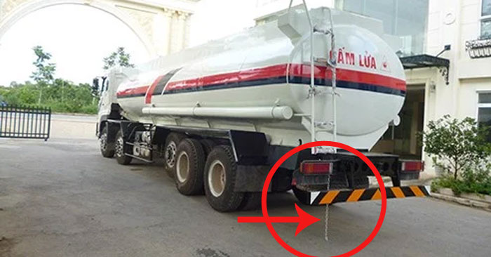 Why do petrol tank trucks hang a long chain in the back?