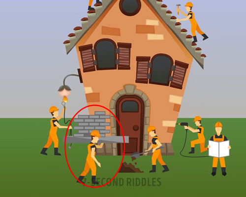 Người thợ xây trong ảnh đang vác hẳn cả một mảng tường trên vai