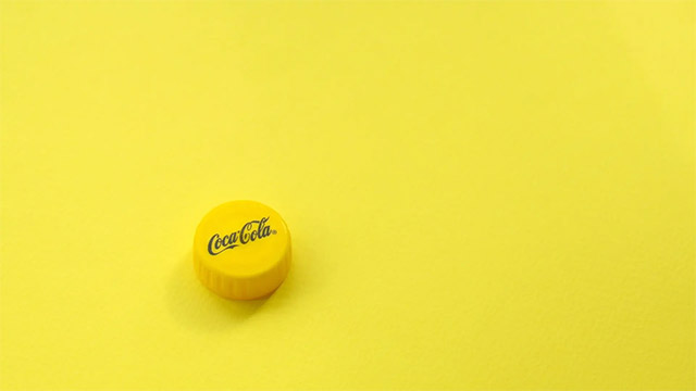 nắp chai coca màu vàng