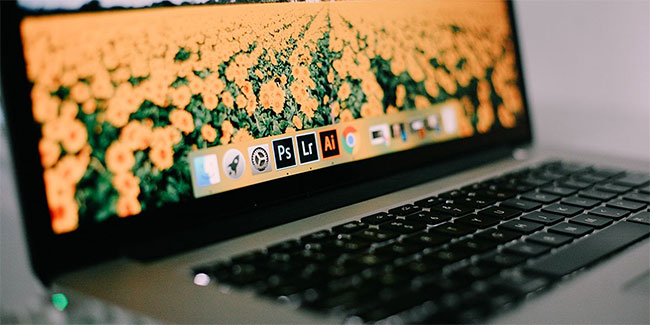 Laptop Mac có launch bar hiển thị 3 biểu tượng ứng dụng Adobe.