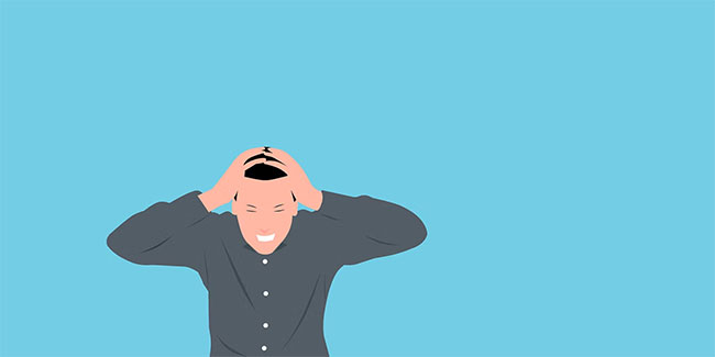 Một người đàn ông căng thẳng ôm đầu