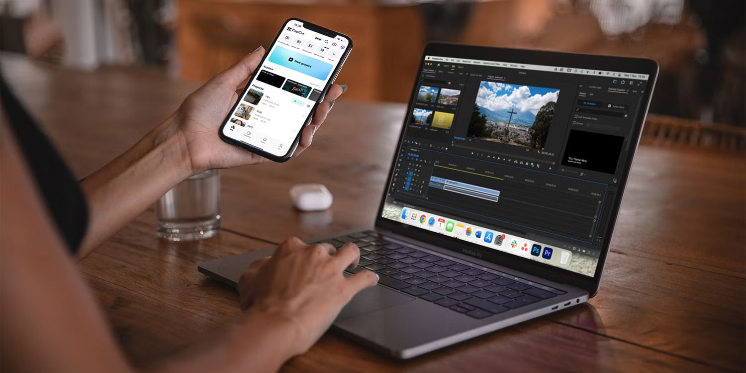 Laptop có Premiere Pro và điện thoại có phần mềm video CapCut.