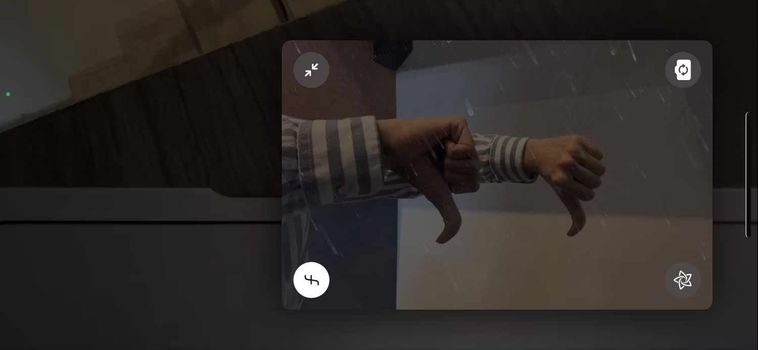 Hai ngón tay cái hướng xuống để kích hoạt reaction mưa của iPhone