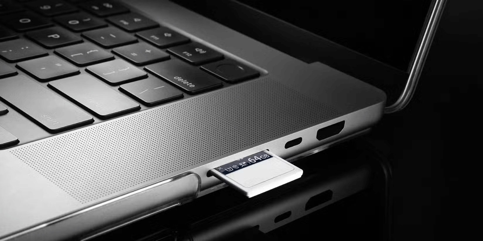 The SD card is inserted into the laptop slot