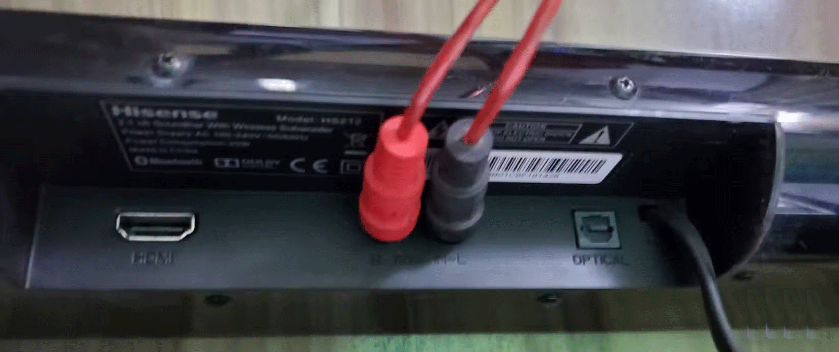 The RCA cable is plugged into the RCA port of the Hisense soundbar